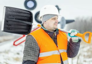 Man working outside in cold weather - Cold weather work risks and tips - Worksite Medical