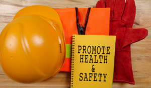 Construction gear with a notebook which reads Promote Health and Safety, used for the ACCHS meeting