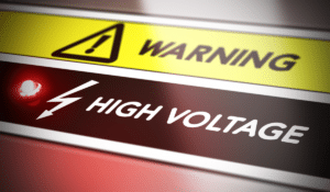 A sign warning of high voltage and electrocution hazards