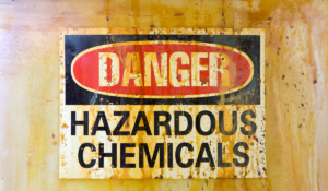 A warning sign which reads Danger Hazardous Chemicals