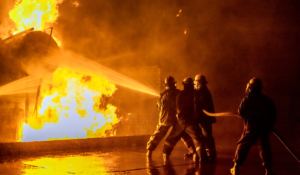 A group of firefighters battling flames, overcoming the dangers of firefighting - Worksite Medical