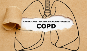 A image of a set of lungs drawn onto brown paper. the paper is being intentionally torn away, revealing the words "Chronic Obstructive Pulmonary Disease COPD" beneath. COPD in the Workplace