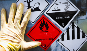 A sign indicating dangerous chemicals and the need for workplace safety, not a safety oversight