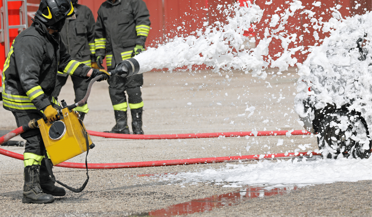 Firefighters training with firefighting foam, which usually contains PFAS chemicals